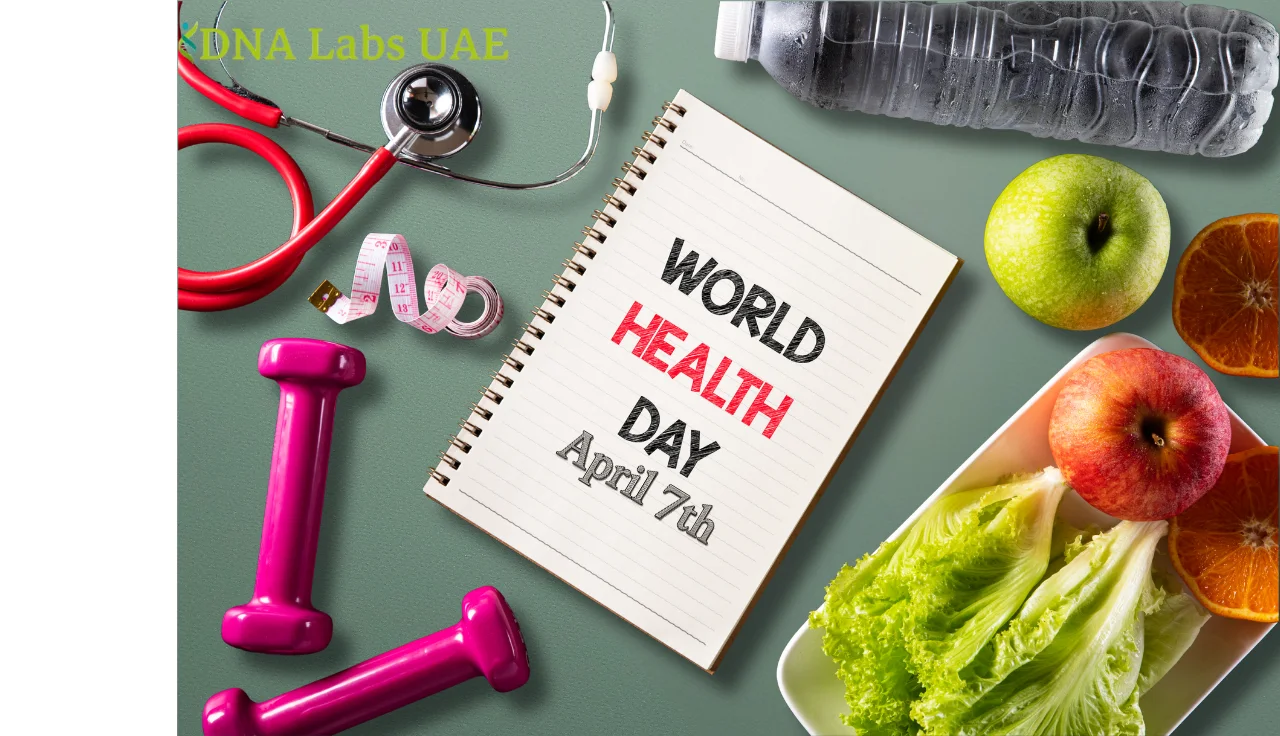 Flat lay of health and wellness items including a stethoscope, pink dumbbells, measuring tape, water bottle, fresh fruits, and a notebook reading “World Health Day April 7th.”